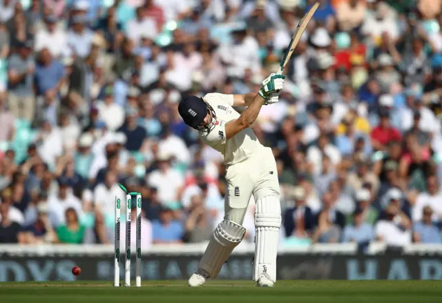 Jos Buttler of England is bowled by Pat Cummins of Australia during day two of the 5th Specsavers Ashes Test match between England and Australia at The Kia Oval