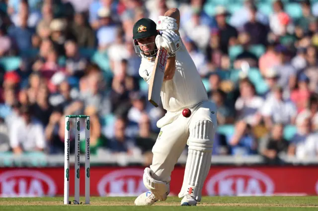 Mitchell Marsh plays a shot during play on the second day of the fifth Ashes cricket Test match between England and Australia at The Oval