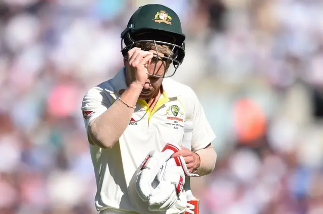 David Warner walks back to the pavilion after losing his wicket for 5 runs during play on the second day of the fifth Ashes cricket Test match between England and Australia at The Oval