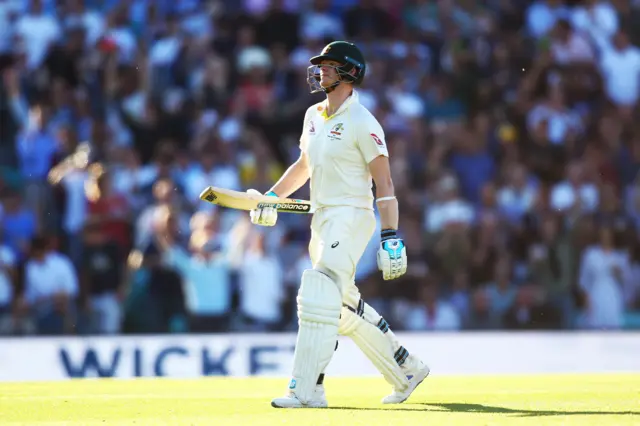 Steve Smith of Australia walks off after being dismissed by Chris Woakes of England during day two of the 5th Specsavers Ashes Test between England and Australia at The Kia Oval