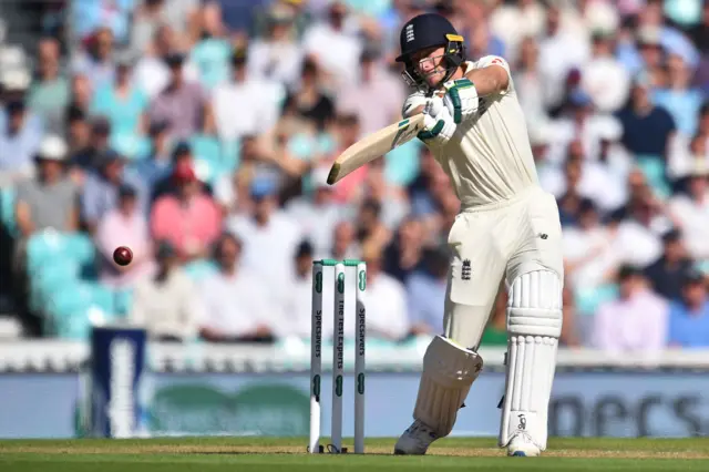 Jos Buttler hits a four during play on the second day of the fifth Ashes cricket Test match between England and Australia at The Oval