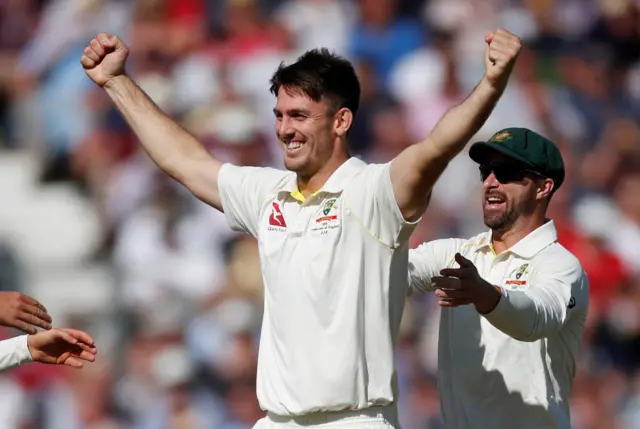 Australia's Mitchell Marsh celebrates taking the wicket of England's Jack Leach