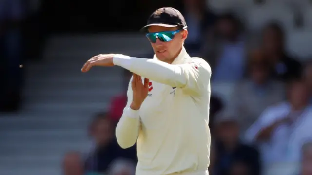 England's Joe Root signals for a review which results in Australia's David Warner being given out