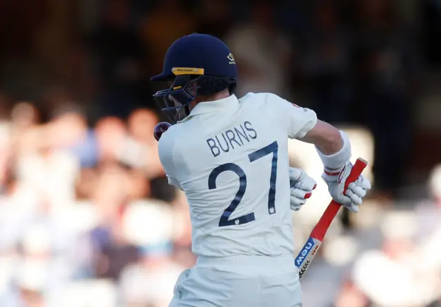 Rory Burns is struck on the helmet by the ball