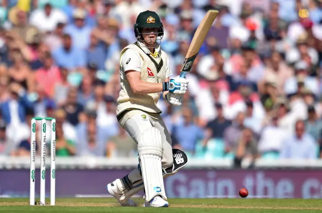 Steve Smith watches the ball after playing a shot during play on the second day of the fifth Ashes cricket Test match between England and Australia at The Oval i