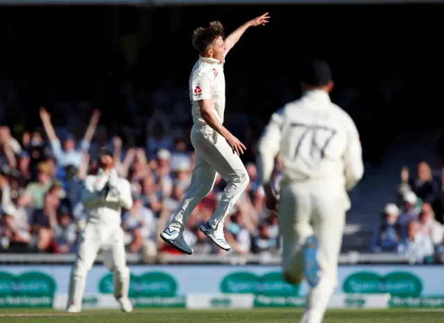 Sam Curran celebrates after taking the wicket of Australia's Tim Paine