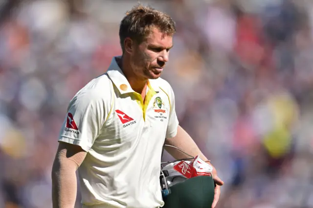 David Warner walks back to the pavilion after losing his wicket for 5 runs during play on the second day of the fifth Ashes cricket Test match between England and Australia at The Oval