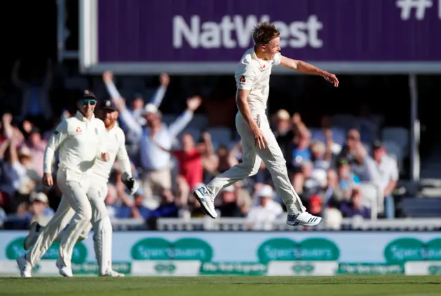 England's Sam Curran celebrates after taking the wicket of Australia's Pat Cummins