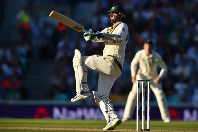 Nathan Lyon hits a six during play on the second day of the fifth Ashes cricket Test match between England and Australia at The Oval