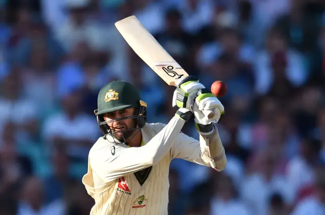 Nathan Lyon plays a shot during play on the second day of the fifth Ashes cricket Test match between England and Australia at The Oval