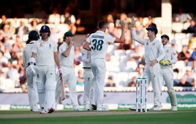 Australia's Josh Hazlewood celebrates the wicket of England's Rory Burns before the decision is overturned following a review