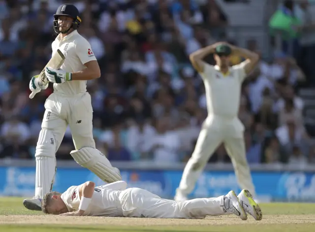 Peter Siddle of Australia reacts while trying to field the ball off his own bowling during day three of the 5th Specsavers Ashes Test between England and Australia at The Kia Oval