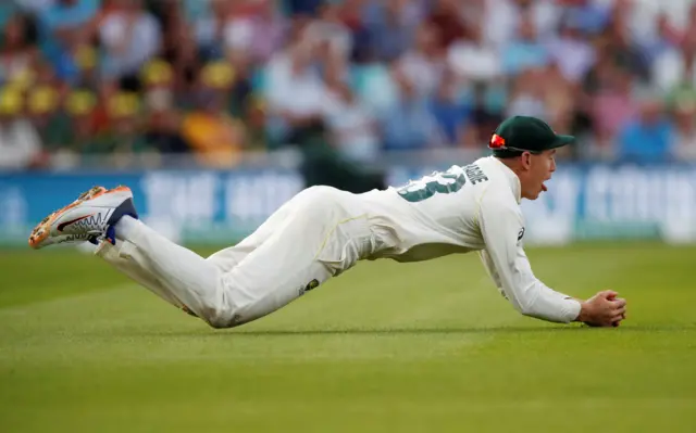 Australia's Marnus Labuschagne catches the ball to dismiss England's Jos Buttler off the bowling of Peter Siddle