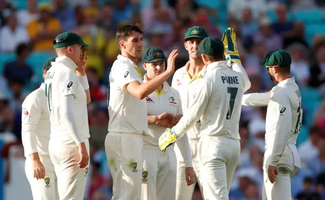 Australia's Tim Paine celebrates his catch to dismiss England's Sam Curran off the bowling of Pat Cummins