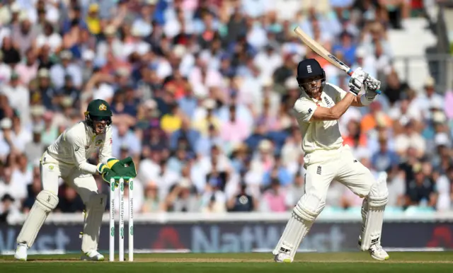 Joe Denly of England bats watched by Australia wicketkeeper Tim Paine during day three of the 5th Specsavers Ashes Test between England and Australia at The Kia Oval