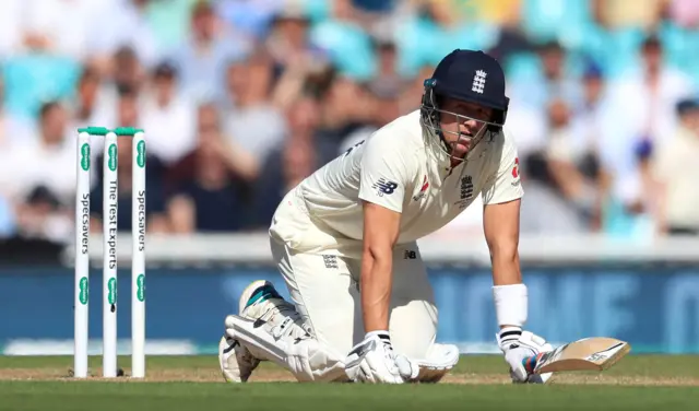 Joe Denly reacts after being hit by the ball during day three of the fifth test match at The Kia Oval