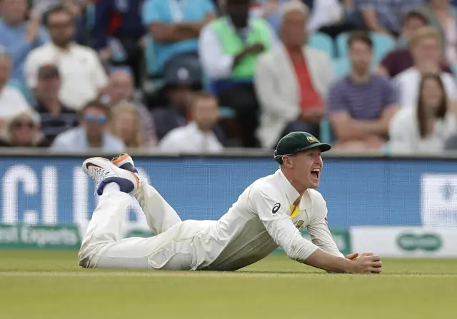 Marnus Labuschagne of Australia celebrates after taking a catch to dismiss Jos Buttler of England off the bowling of Peter Siddle of Australia during day three of the 5th Specsavers Ashes Test between England and Australia at The Kia Oval