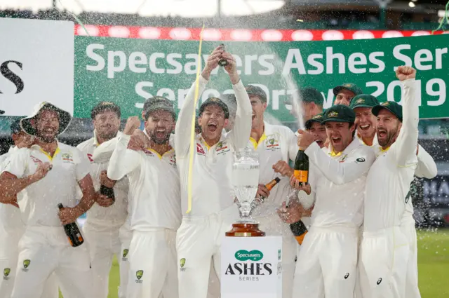 Australia's Tim Paine holds up the Ashes urn as Australia celebrate retaining the Ashes