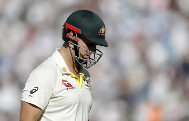 Mitch Marsh of Australia looks dejected after being dismissed by Joe Root of England during day four of the 5th Specsavers Ashes Test between England and Australia at The Kia Oval