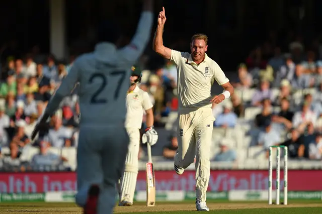 Stuart Broad celebrates taking the wicket of Australia's Pat Cummins during play on the fourth day of the fifth Ashes cricket Test match between England and Australia at The Oval i