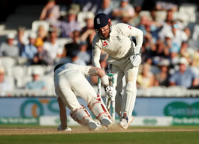 England's Jonny Bairstow looks on as Australia's Matthew Wade prevents a runout