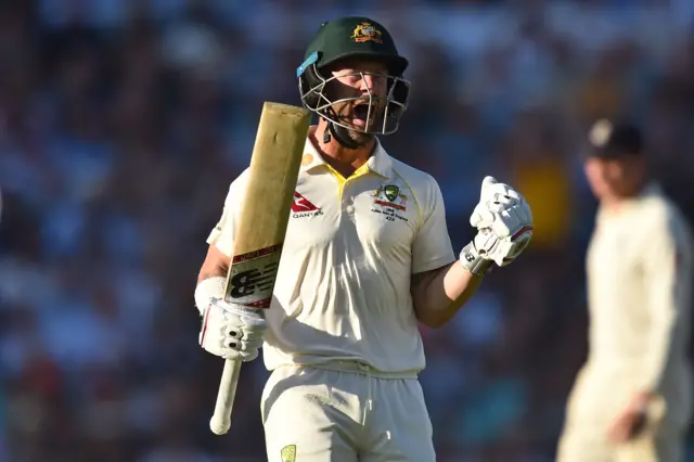 Matthew Wade celebrates after reaching his century during play on the fourth day of the fifth Ashes cricket Test match between England and Australia at The Oval