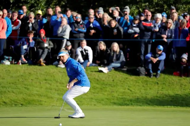 Charley Hull's misses a putt on the 17th green to win her match