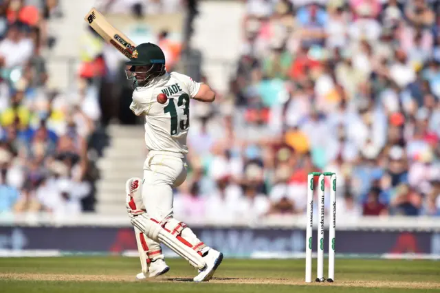 Matthew Wade takes a swing at the ball during play on the fourth day of the fifth Ashes cricket Test match between England and Australia at The Oval