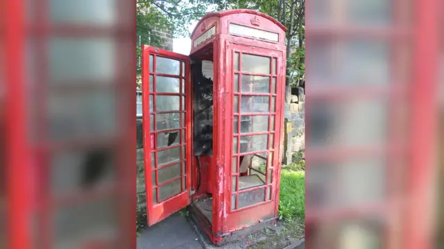 The damaged phone box