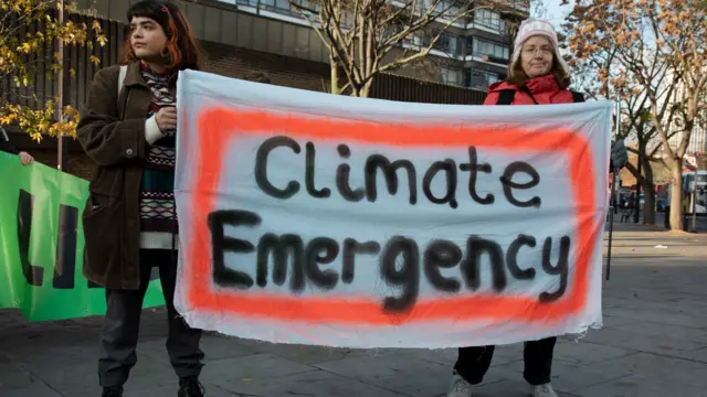 Climate change activists from the Extinction Rebellion group block roads in central London