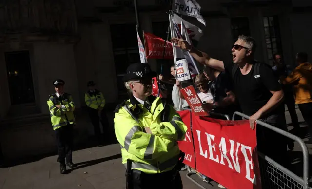 Protesters gather outside The Supreme Court ahead of a hearing on the legality of proroguing Parliament,