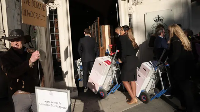 Documents are wheeled into the Supreme Court ahead of a hearing on the legality of proroguing Parliament