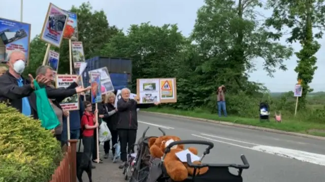 Protests outside village