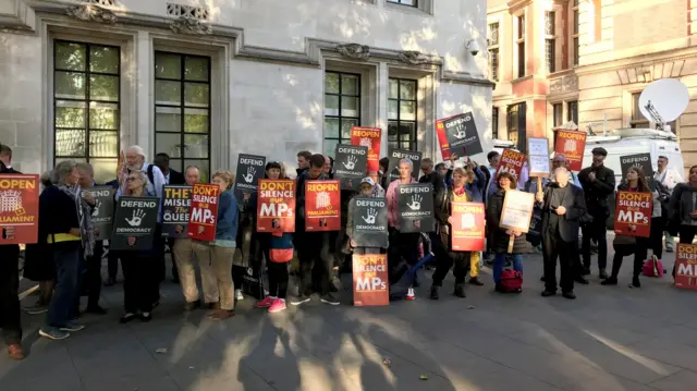 Protesters outside the Supreme Court in London where judges are due to consider legal challenges to Prime Minister Boris Johnson"s decision to suspend Parliament.