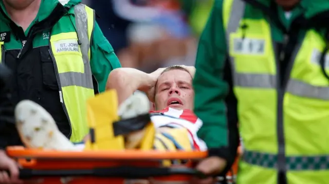 Stoke City"s Ryan Shawcross is stretchered off after sustaining an injury