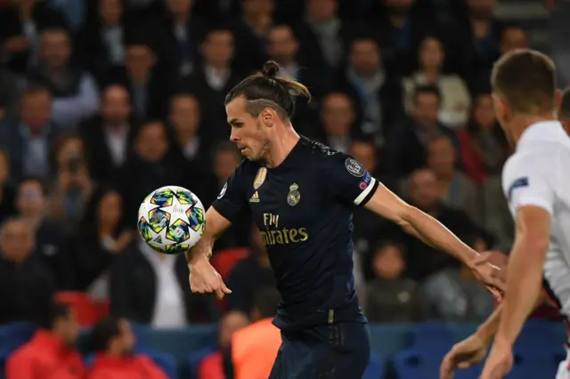 The ball brushes the forearm of Gareth Bale as he prepares to shoot