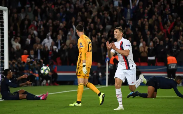 Thomas Meunier celebrates as Real Madrid  players are left on their knees