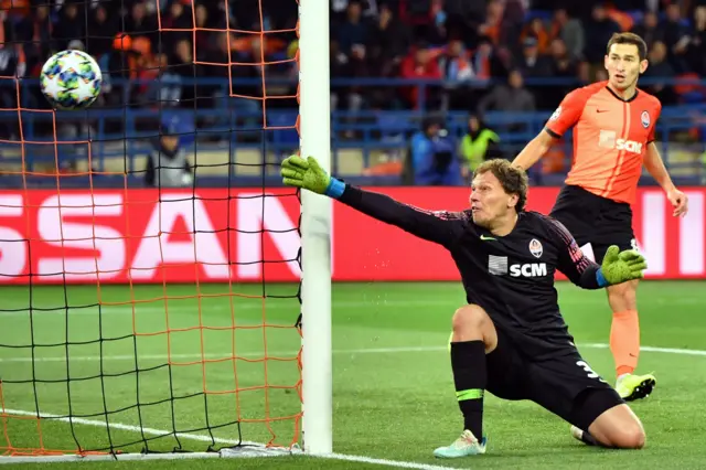 Shakhtar Donetsk goalkeeper Andriy Pyatov watches as Raheem Sterling's shot hits the side-netting after clipping the post