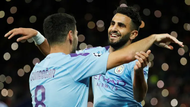 Ilkay Gundogan and Riyad Mahrez celebrate