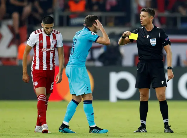 Harry Winks is shown a yellow card