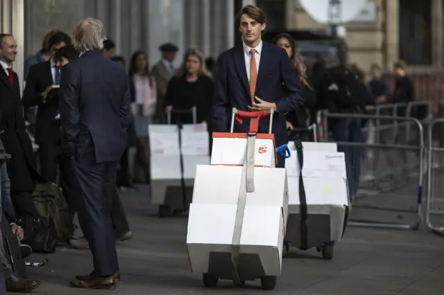 Legal papers are wheeled into the Supreme Court ahead of the hearing