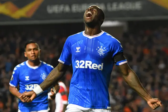 Sheyi Ojo celebrates his opener at Ibrox