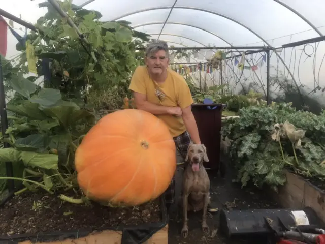Simon Croson and a large pumpkin
