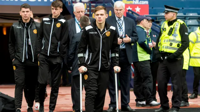 Craig Tanner on crutches