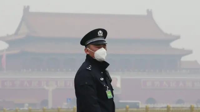 Chinese policeman with face mask