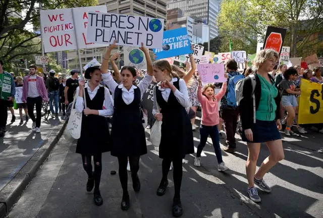 Schoolchildren join a climate protest in Sydney, Australia