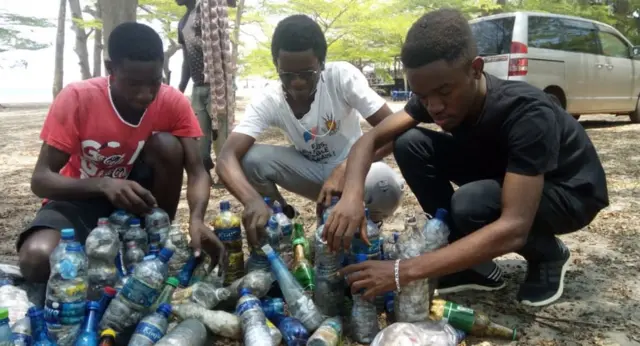 The volunteers with some of the plastic they picked up