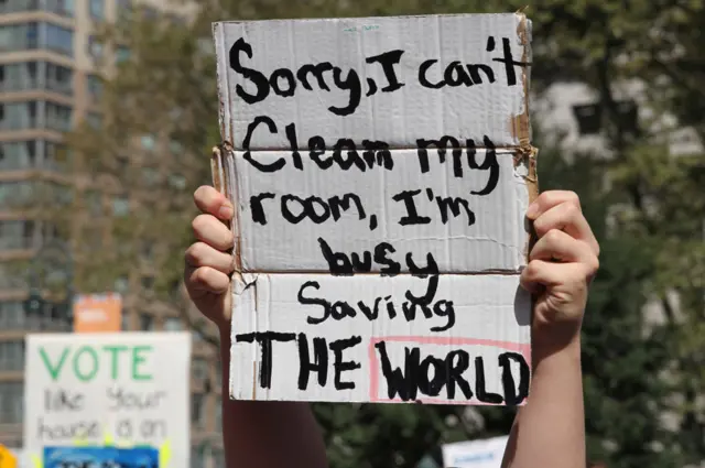 Sign saying 'Sorry, I can't clean my room, I'm busy saving the world'