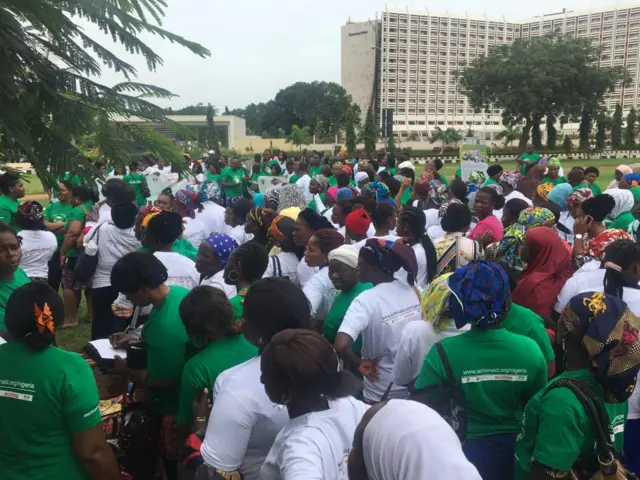 Hundreds of protesters wear green t-shirts in Abuja