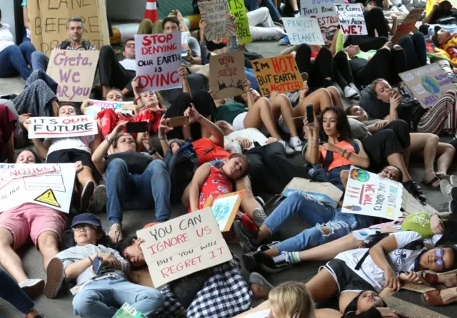 Climate protesters stage a die-in in Bangkok, Thailand